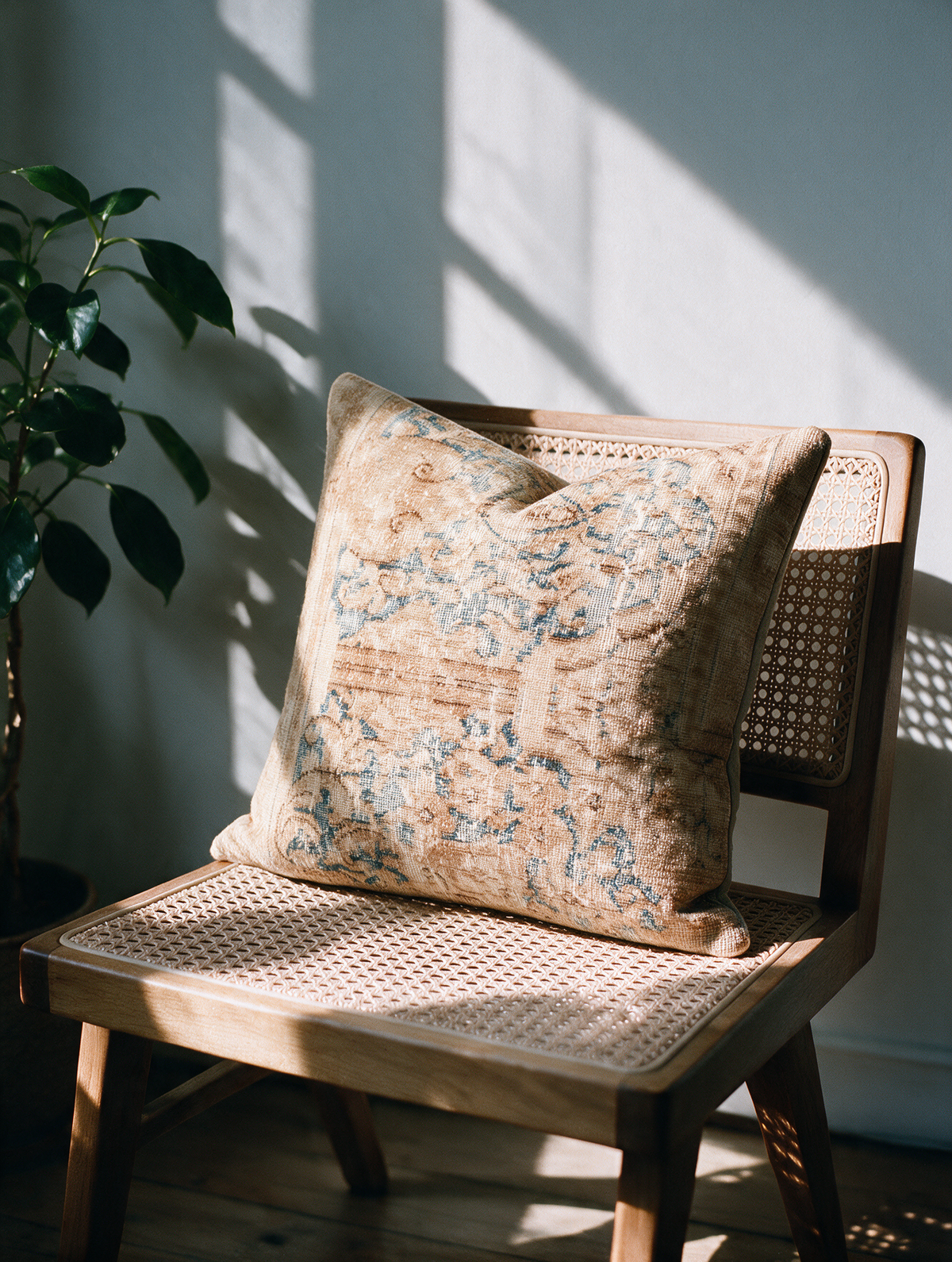 Vintage Persian hand-knotted cushion cover styled lifestyle shot