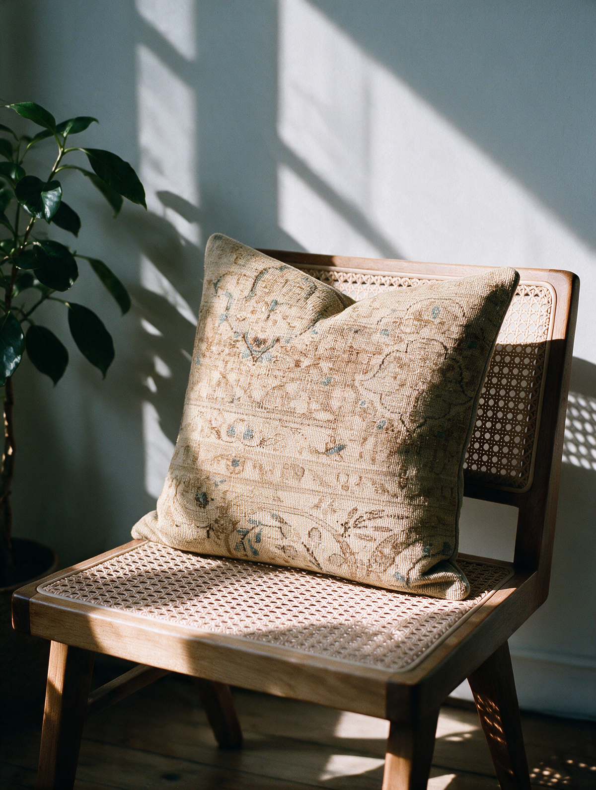 Vintage Persian hand-knotted cushion cover styled lifestyle shot