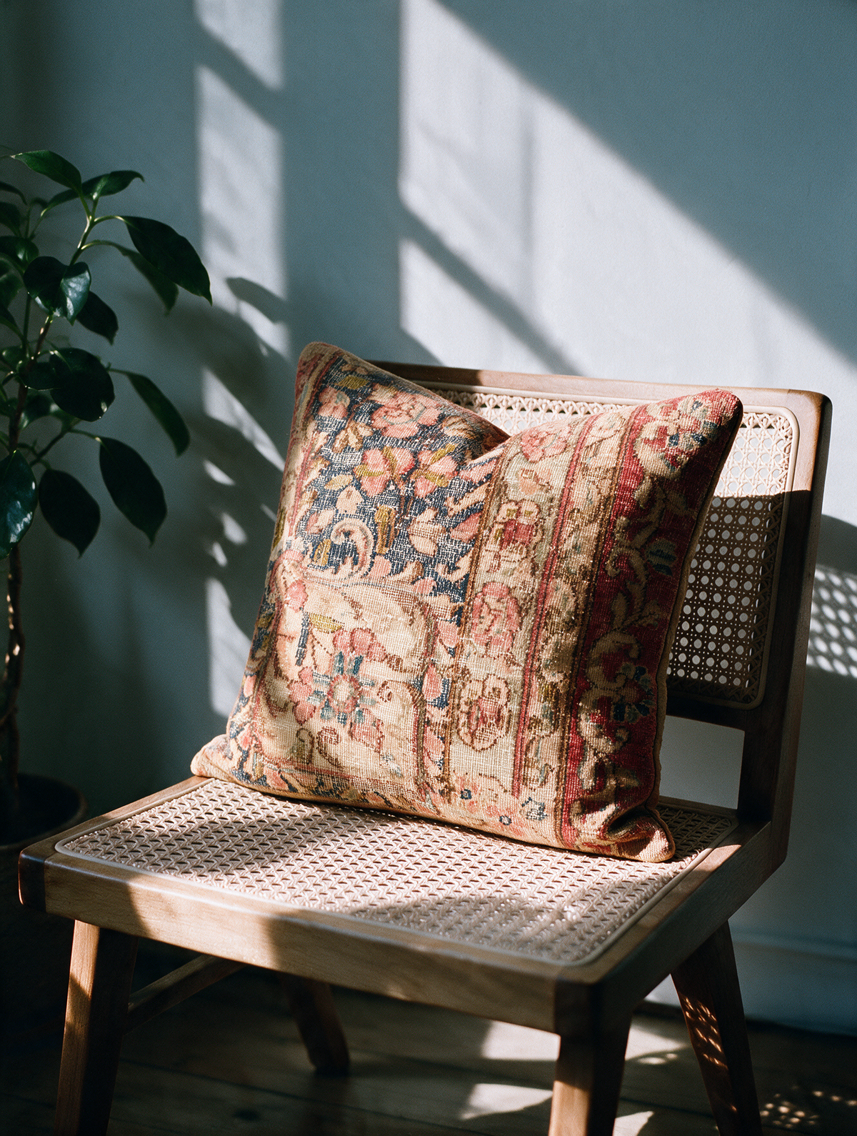 Vintage Persian hand-knotted cushion cover styled lifestyle shot