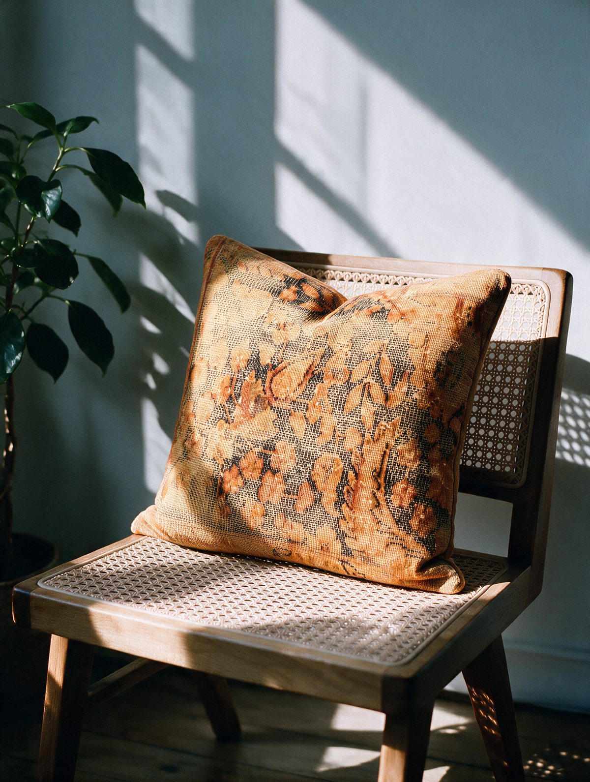 Vintage Persian hand-knotted cushion cover styled lifestyle shot