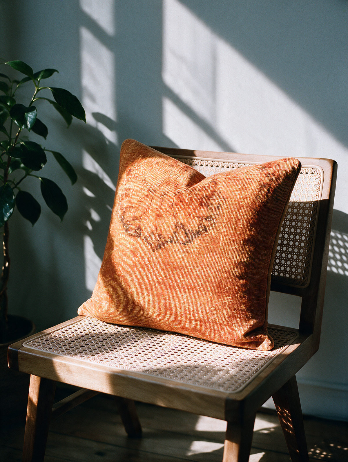 Vintage Persian hand-knotted cushion cover styled lifestyle shot
