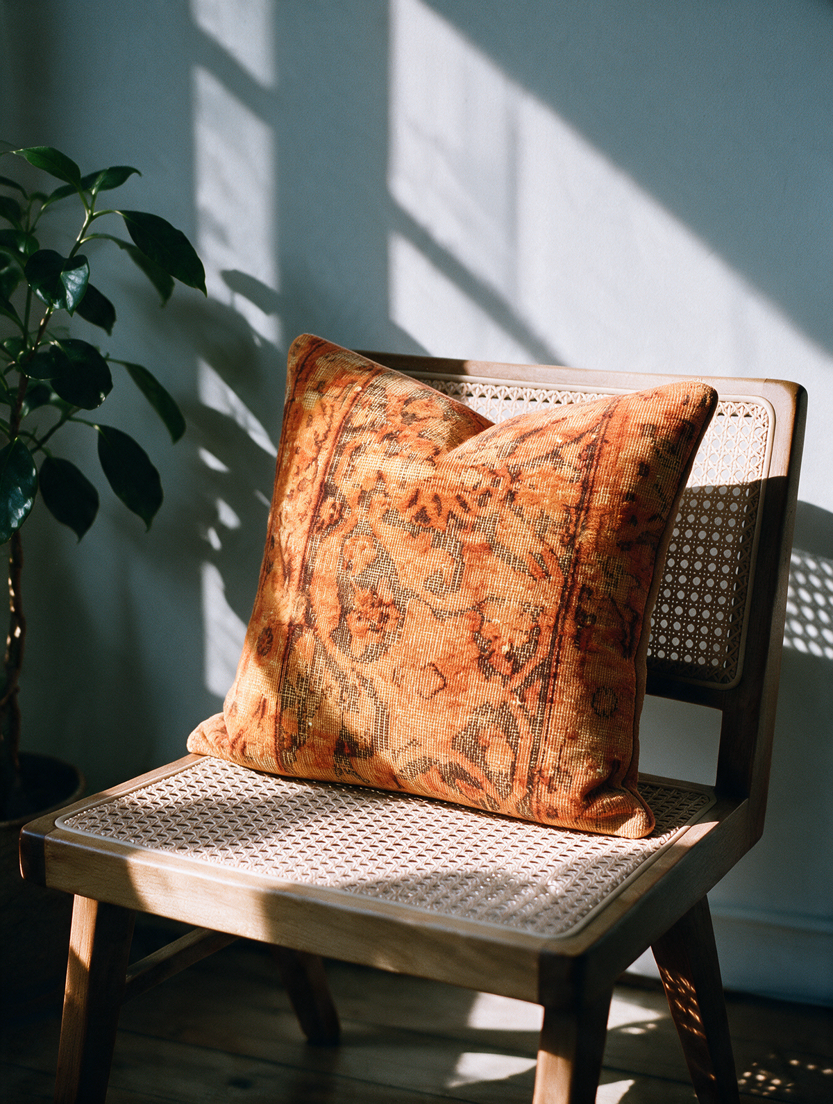 Vintage Persian hand-knotted cushion cover styled lifestyle shot