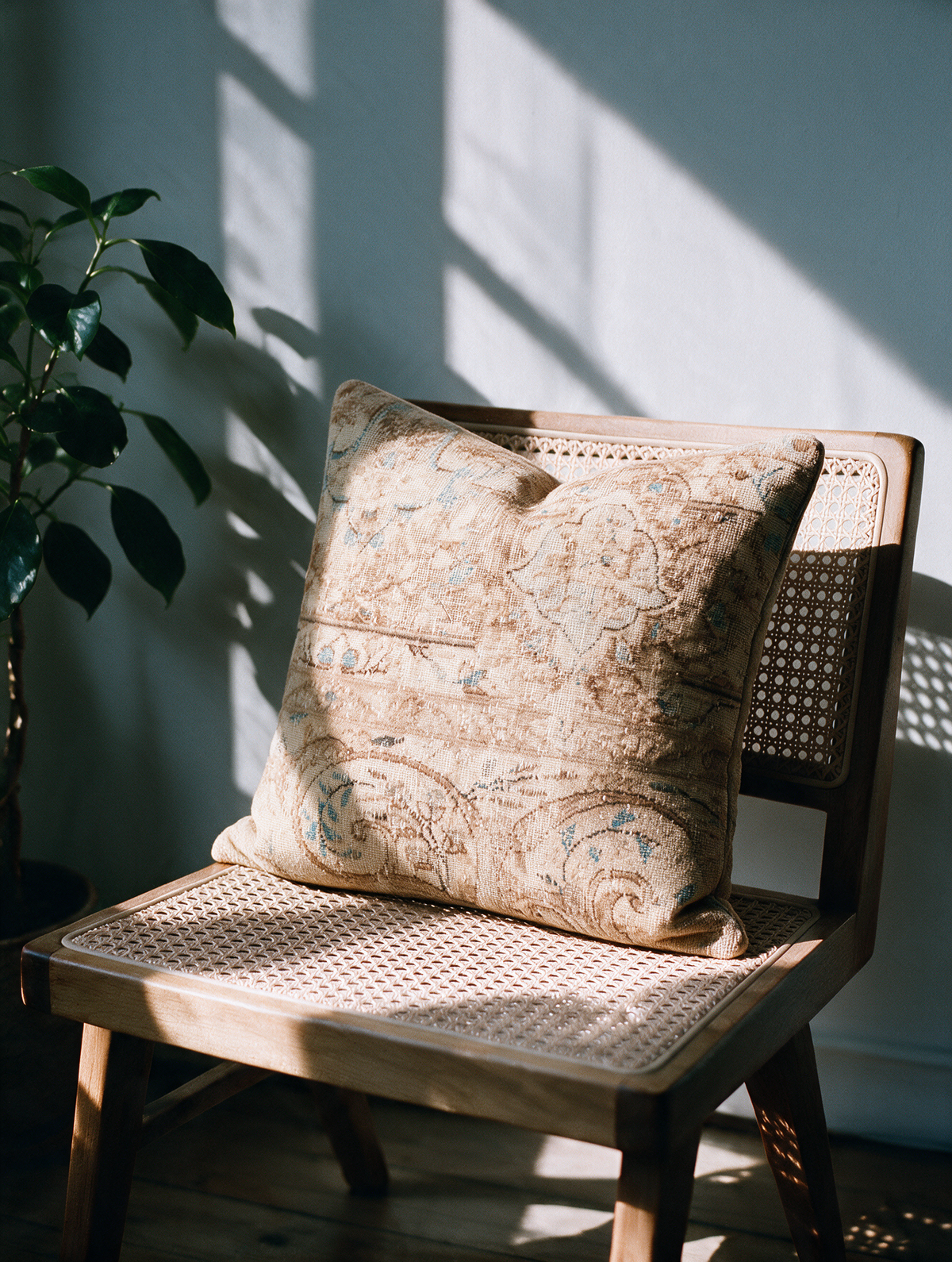 Vintage Persian hand-knotted cushion cover styled lifestyle shot