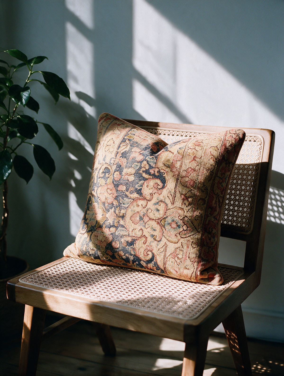 Vintage Persian hand-knotted cushion cover styled lifestyle shot