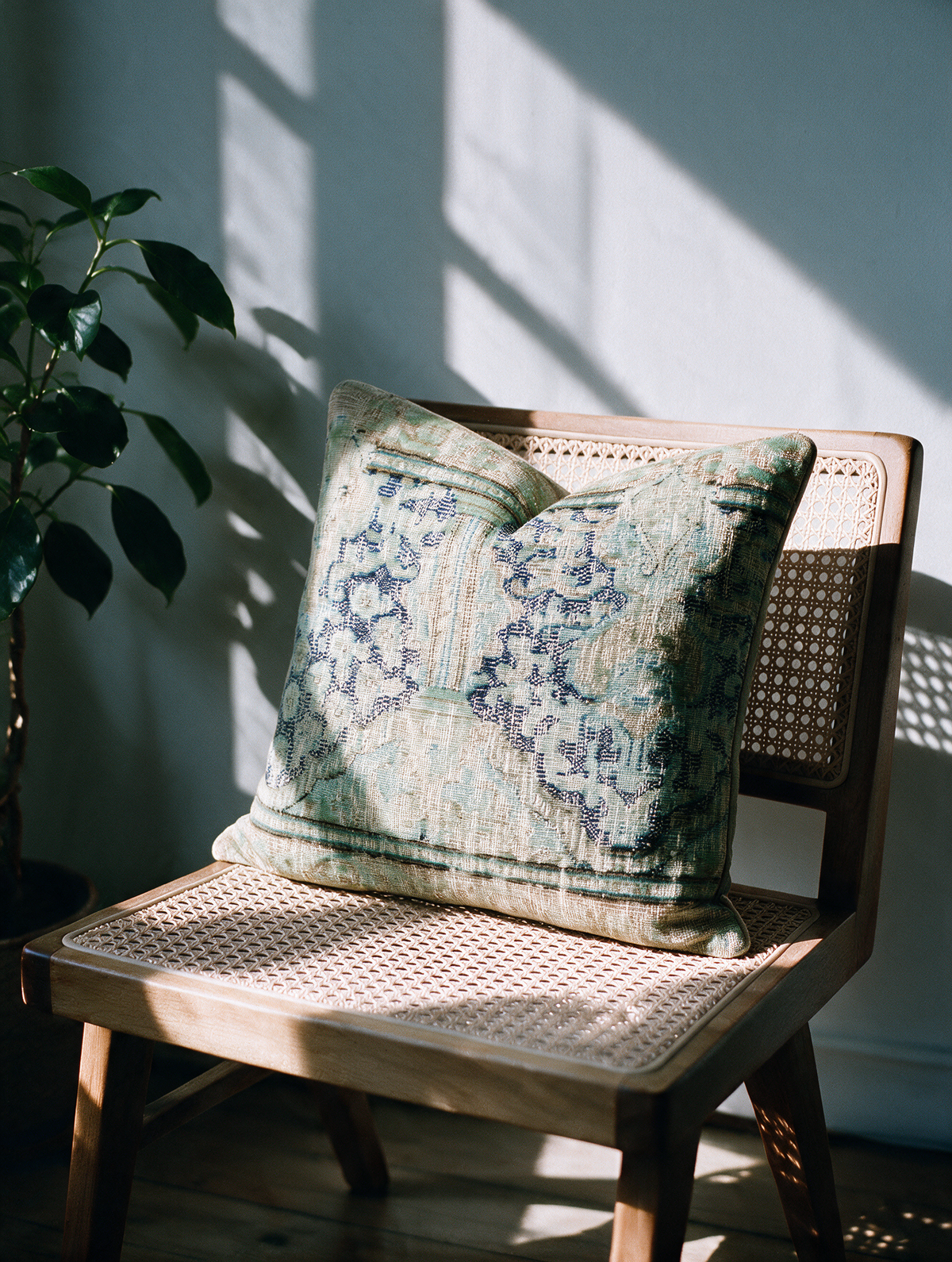 Vintage Persian hand-knotted cushion cover styled lifestyle shot