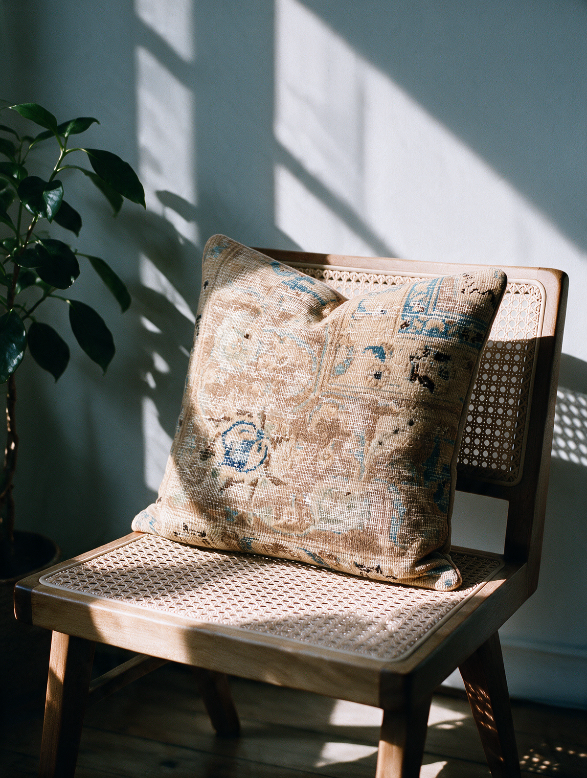 Vintage Persian hand-knotted cushion cover styled lifestyle shot