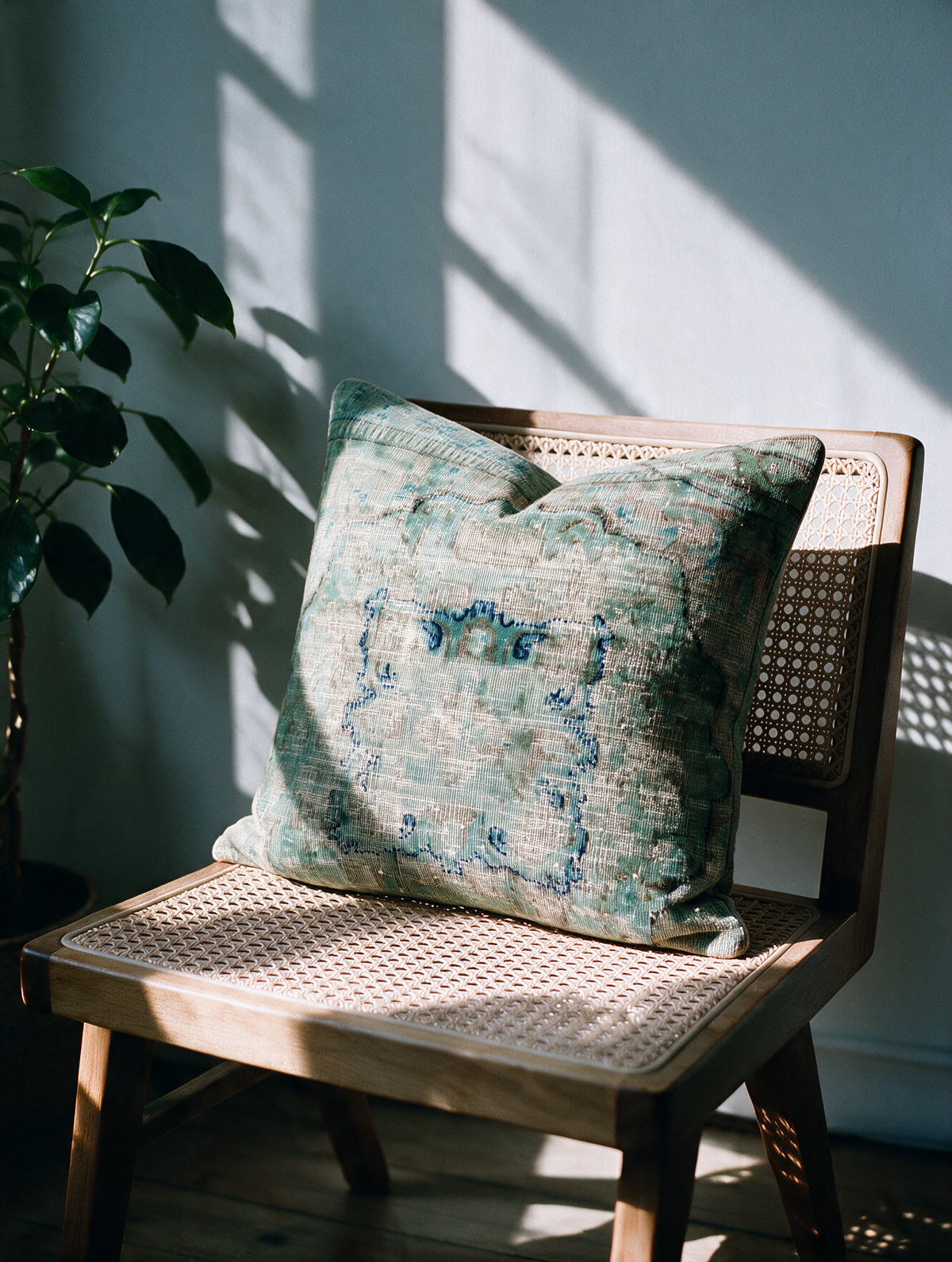 Vintage Persian hand-knotted cushion cover styled lifestyle shot