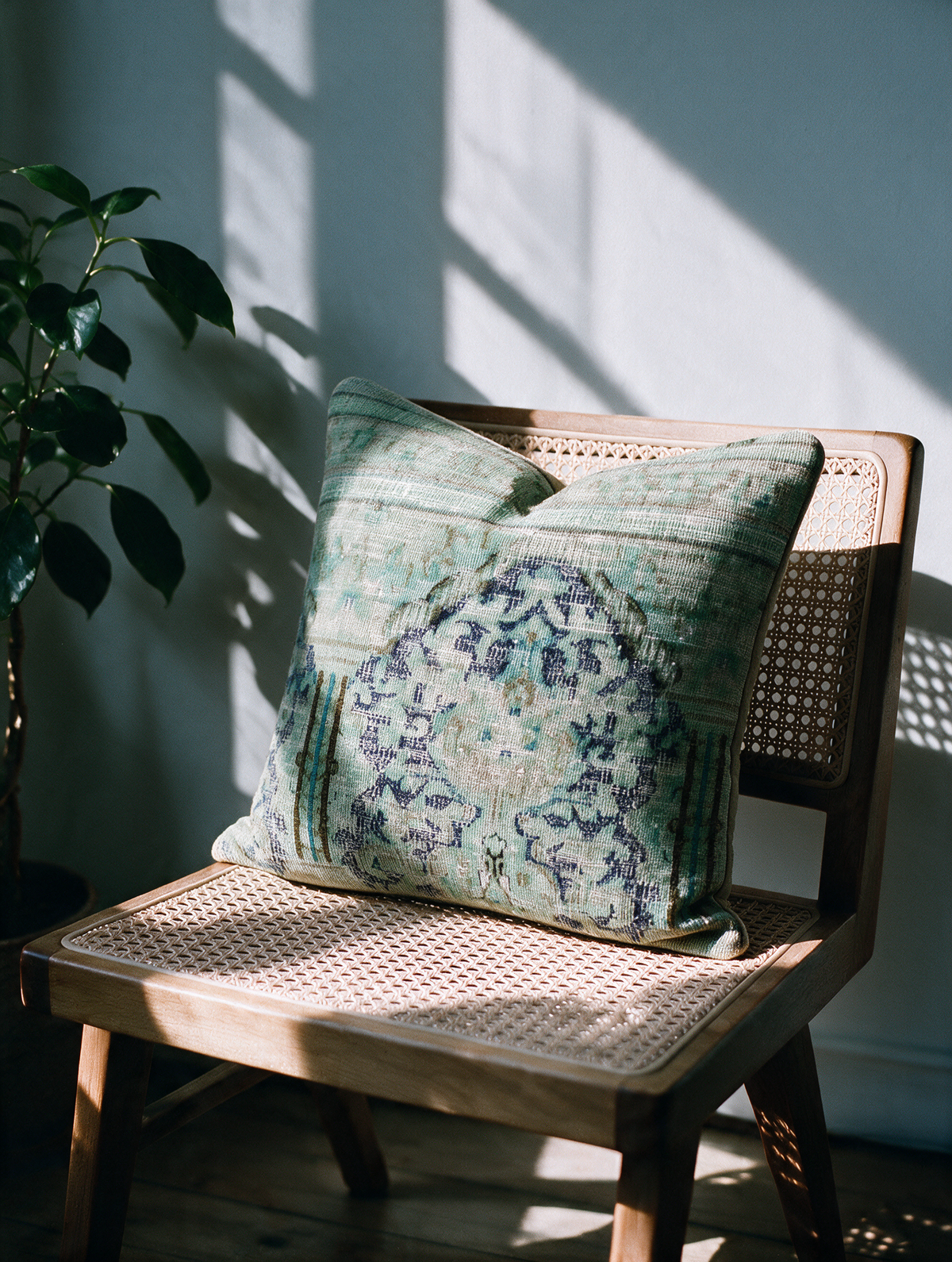 Vintage Persian hand-knotted cushion cover styled lifestyle shot
