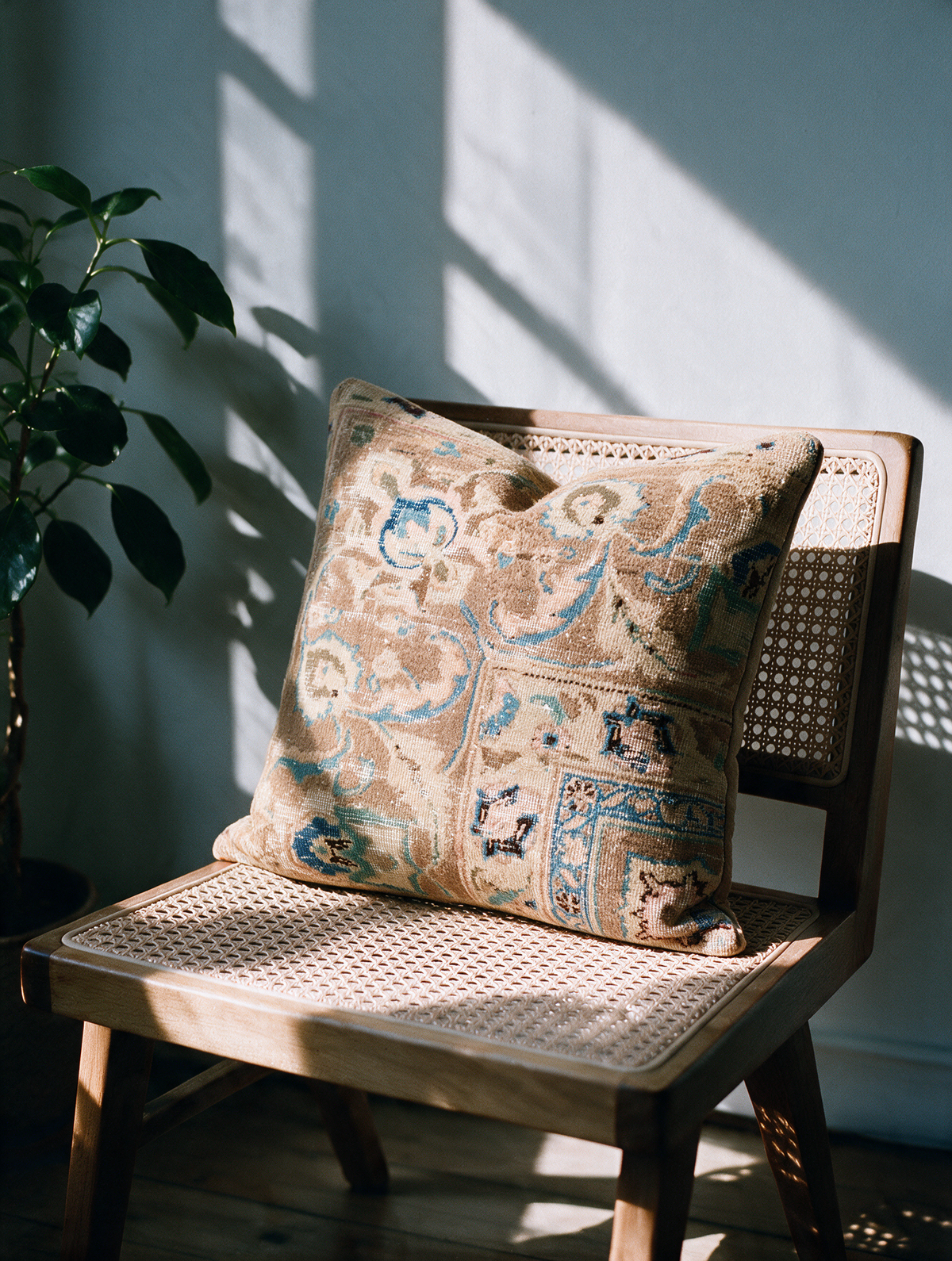 Vintage Persian hand-knotted cushion cover styled lifestyle shot