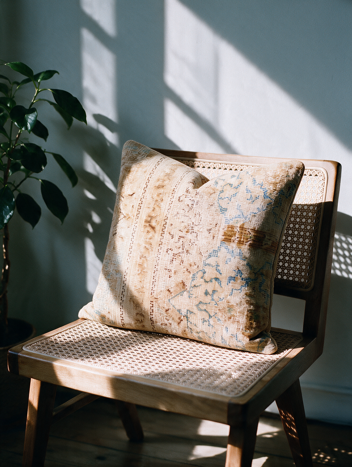 Vintage Persian hand-knotted cushion cover styled lifestyle shot