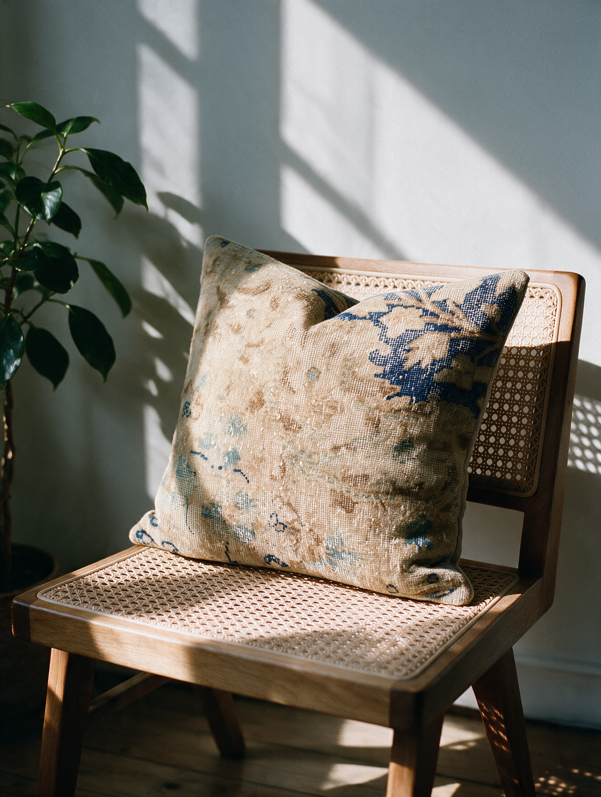 Vintage Persian hand-knotted cushion cover styled lifestyle shot