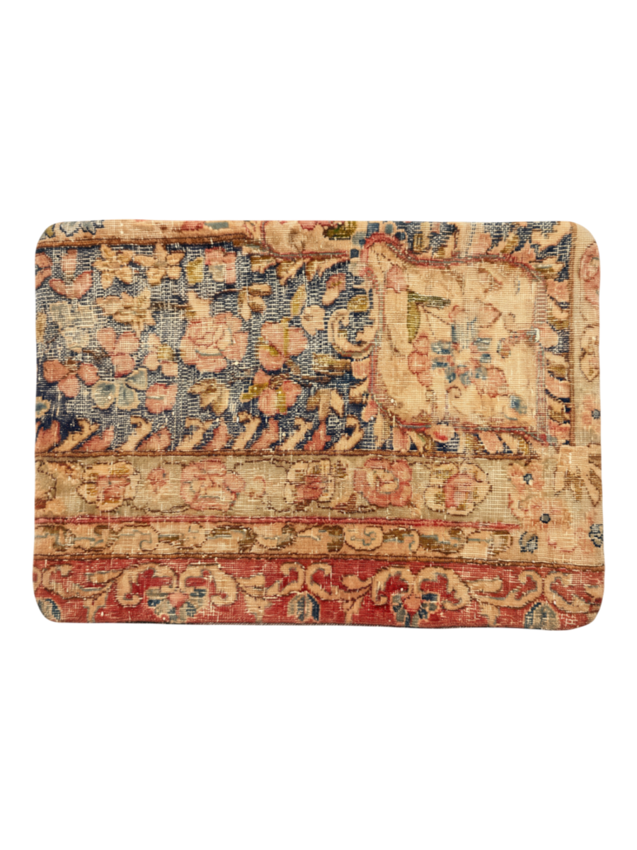 Vintage Persian hand-knotted cushion cover, flat lay