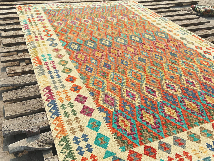Kilims laid flat on wooden boards, drying in the sun
